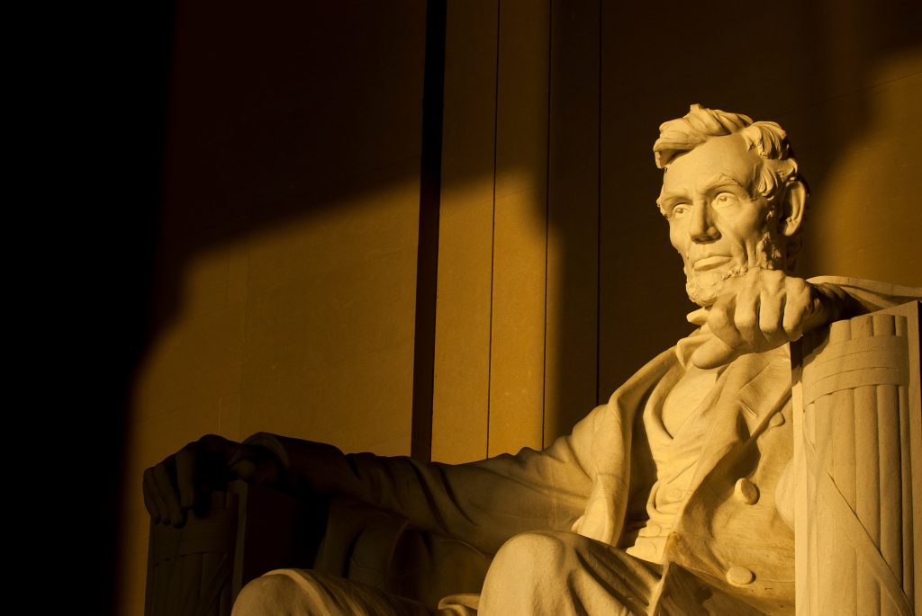 Statue of Abraham Lincoln in brilliant warm dramatic morning sunlight